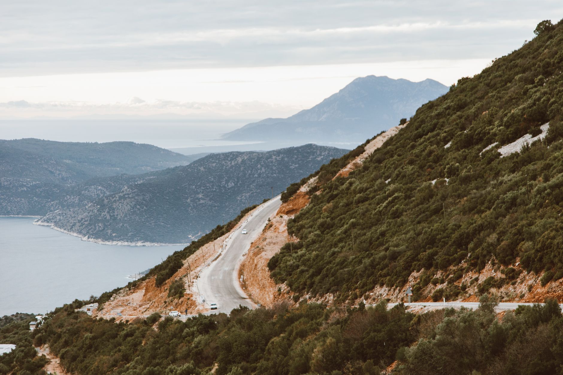 Quiet scenic road through coastal hills and ancient stone villas